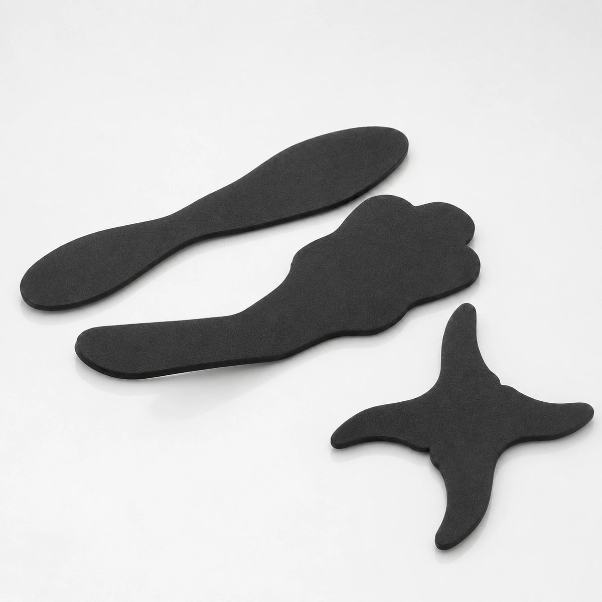 Flexible dental contraster set with three black background shapes.