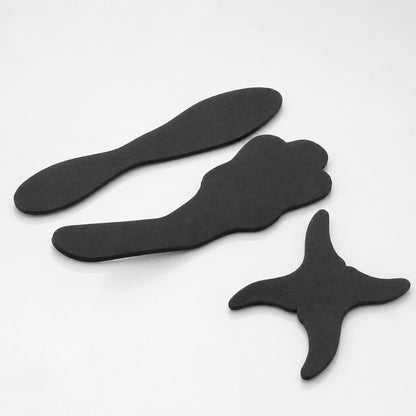 Flexible dental contraster set with three black background shapes.
