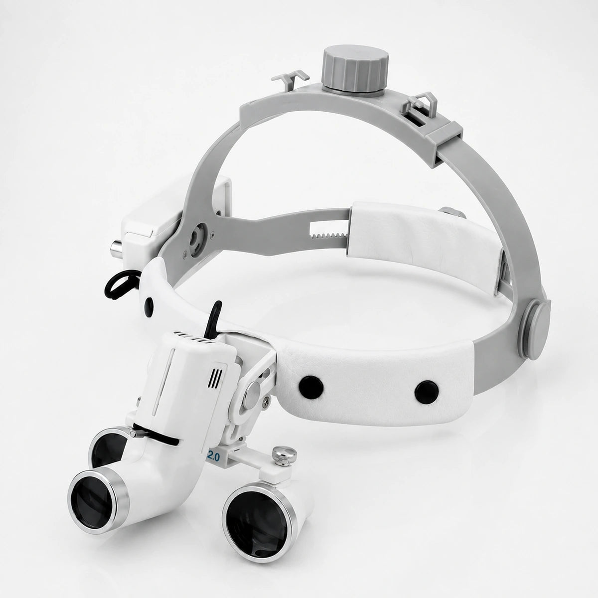 Dental loupes with integrated LED headlight and adjustable headband for dentists.