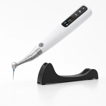 white cordless endodontic motor with a file attached, next to its stand