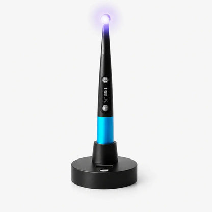 i-Light Pro dental LED curing light on charging base for composite curing.