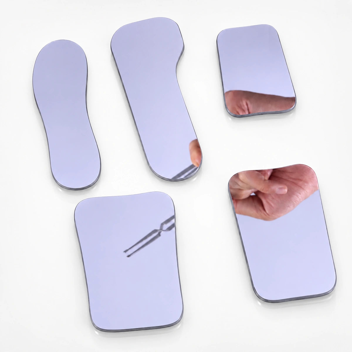 Set of five intraoral mirrors in occlusal, buccal, and lingual shapes for dental photography