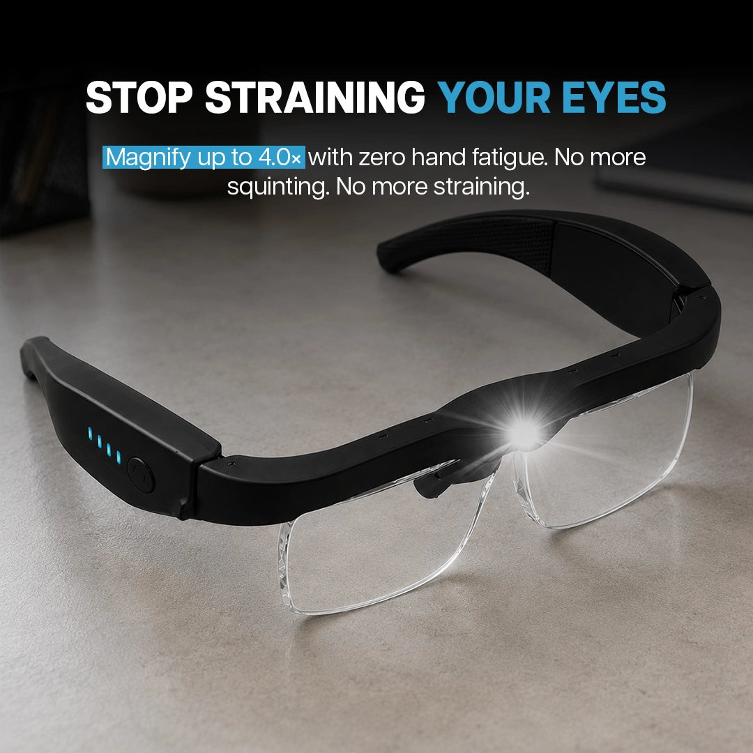 LED magnifying glasses with light turned on sitting on a desk.