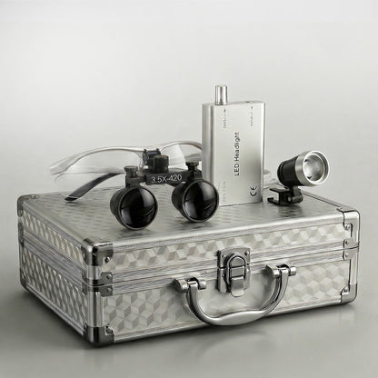 dental binoculars with headlight and carrying case in silver