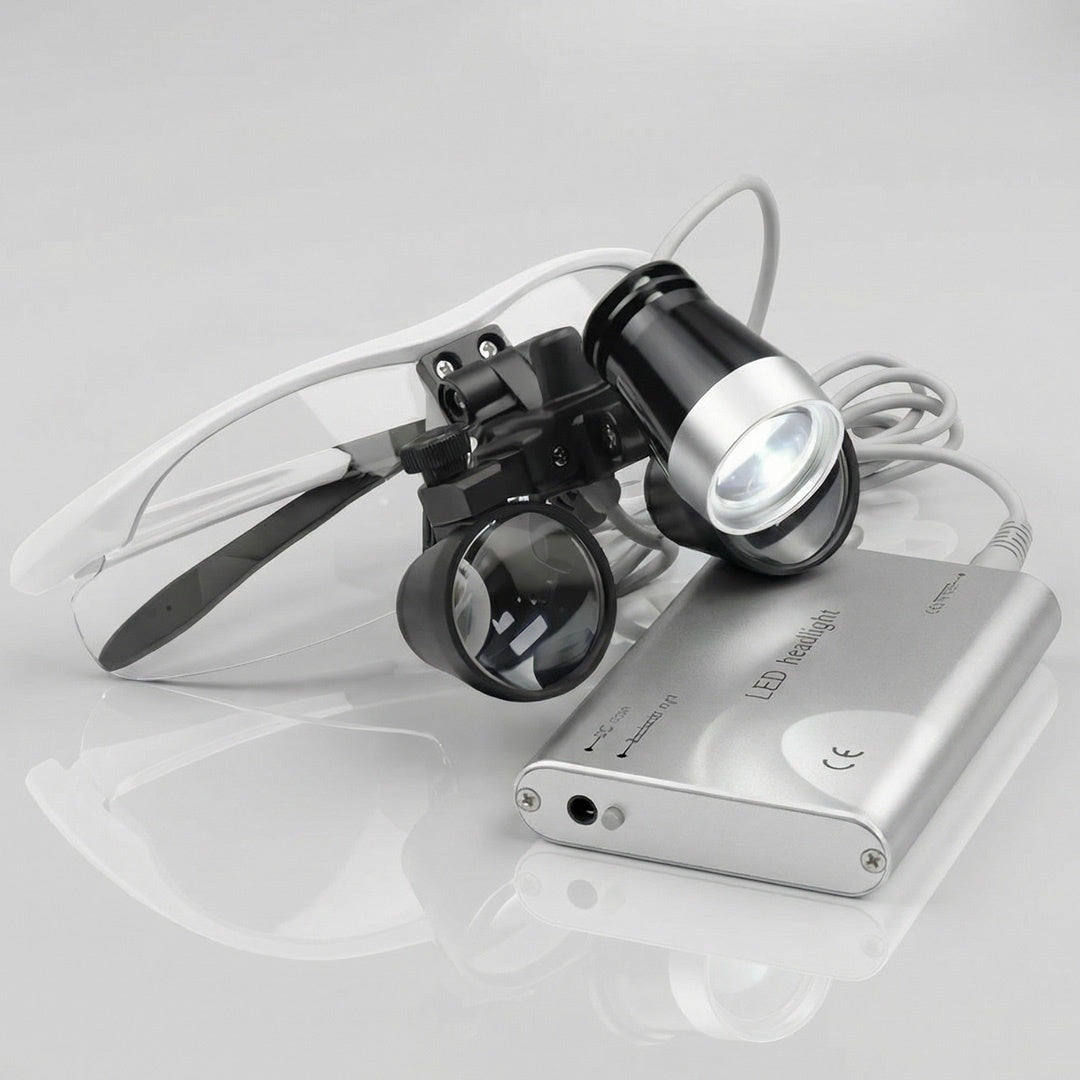 silver dental binoculars with clip-on LED headlight and battery